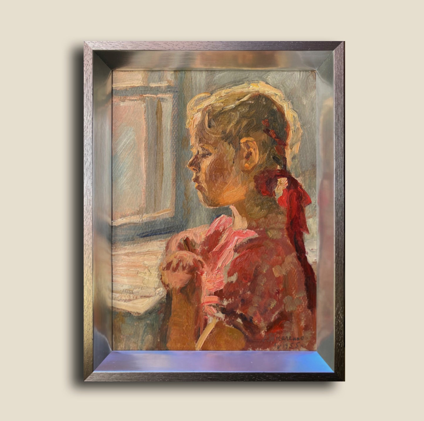 Portrait of a little girl at the window. 1955.